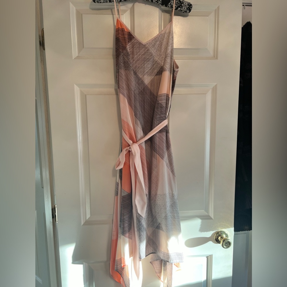 Spaghetti strap dress, with a shark hem.